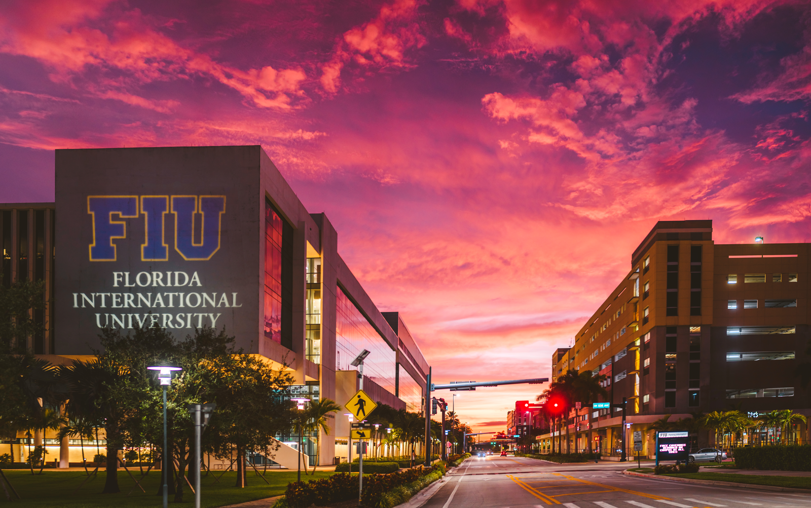 View of a sunset behind buildings at Florida International University.