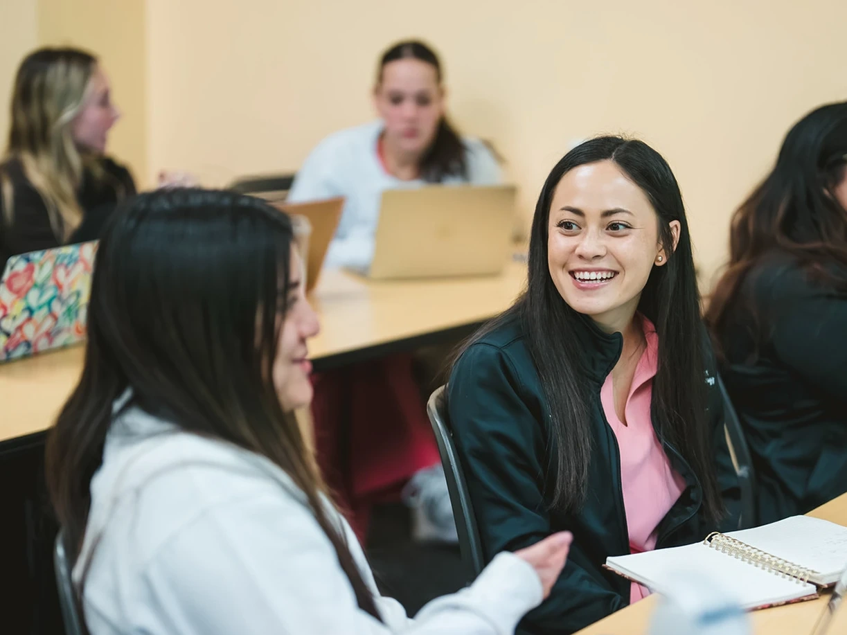 FIU students engaged in a small-group discussion.