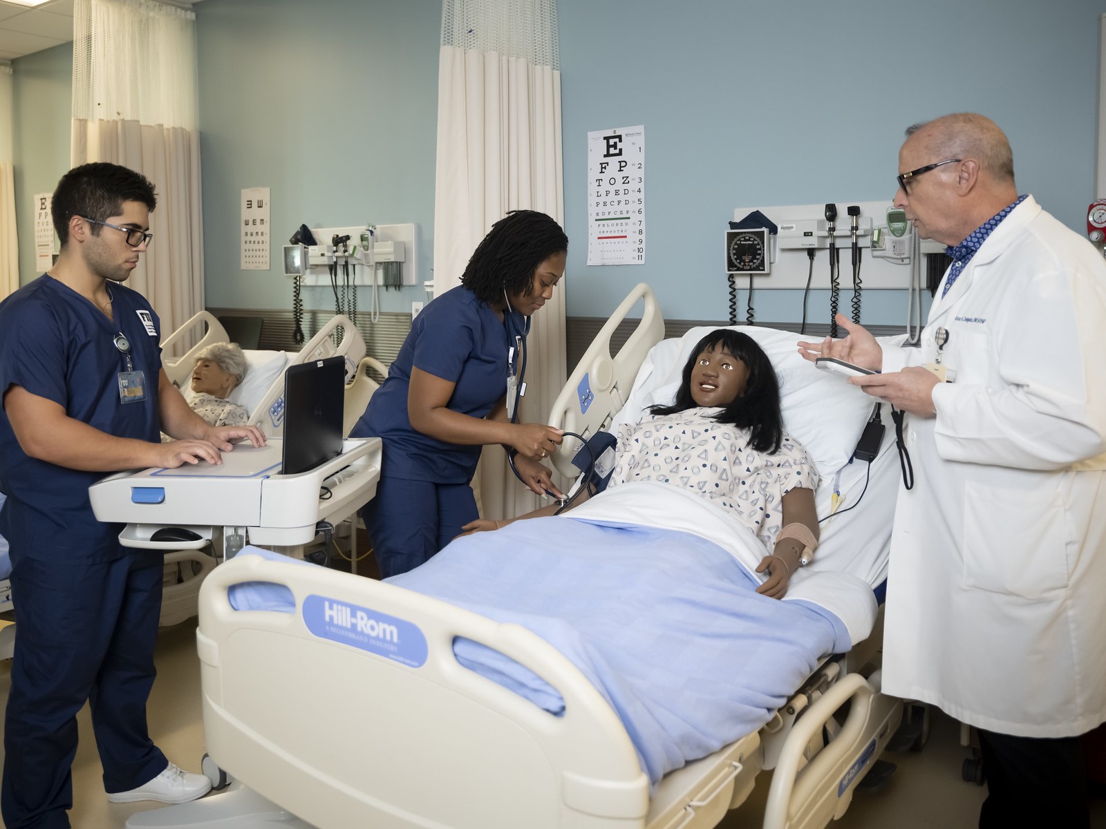 Image of faculty instructing nursing students