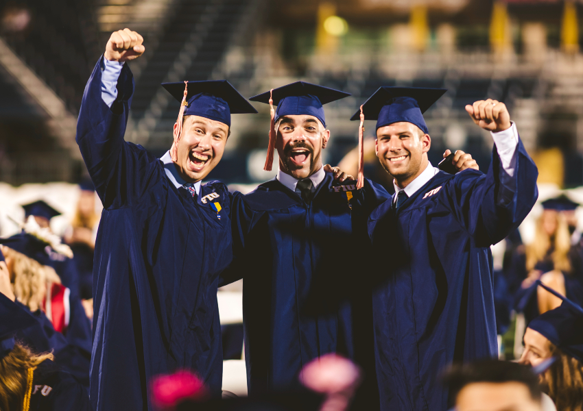 FIU students cheering at graduation