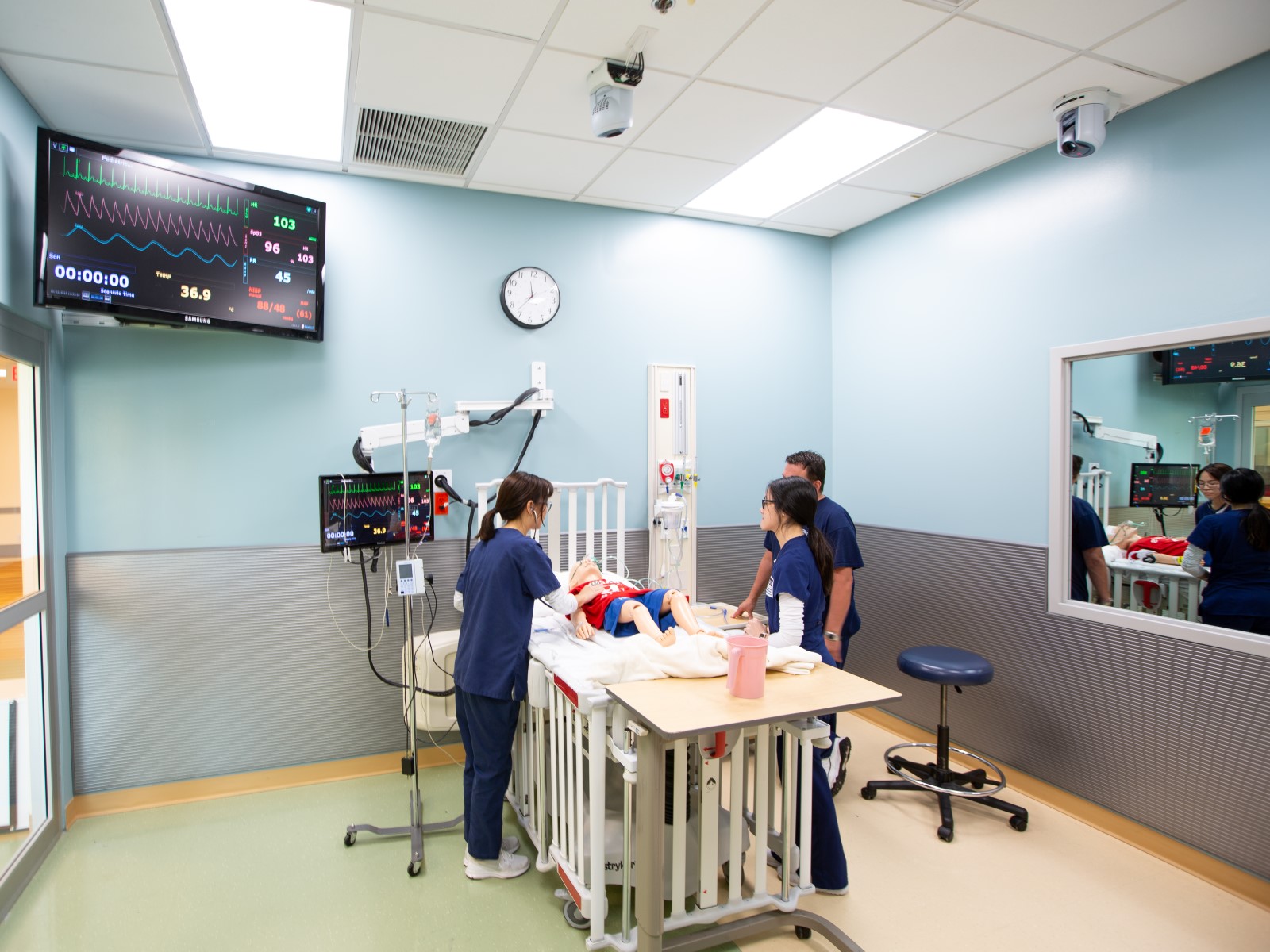 Image of FIU Nursing undergraduates simulating child care